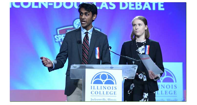 Two students performing at Nationals on stage