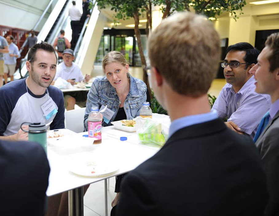 Group of people having a discussion over lunch